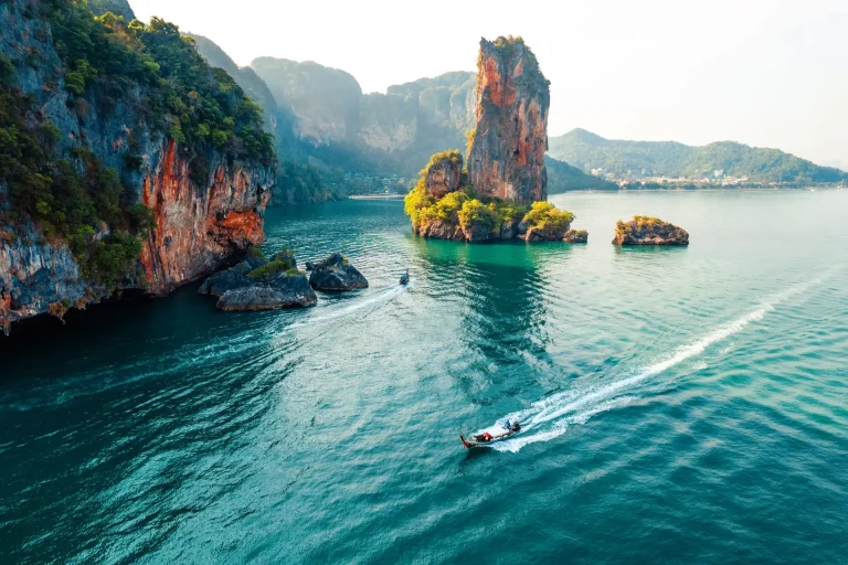 Sea views and rocky islands with a long-tail boat.form above in krabi