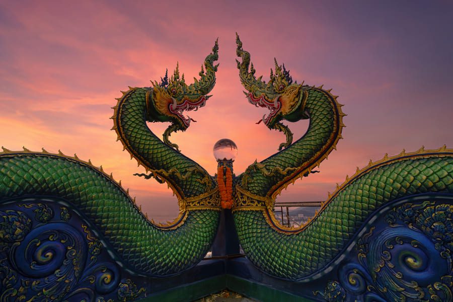 Traditional Thai temple featuring intricate golden roof details and historic architecture, ideal for cultural discovery tours.