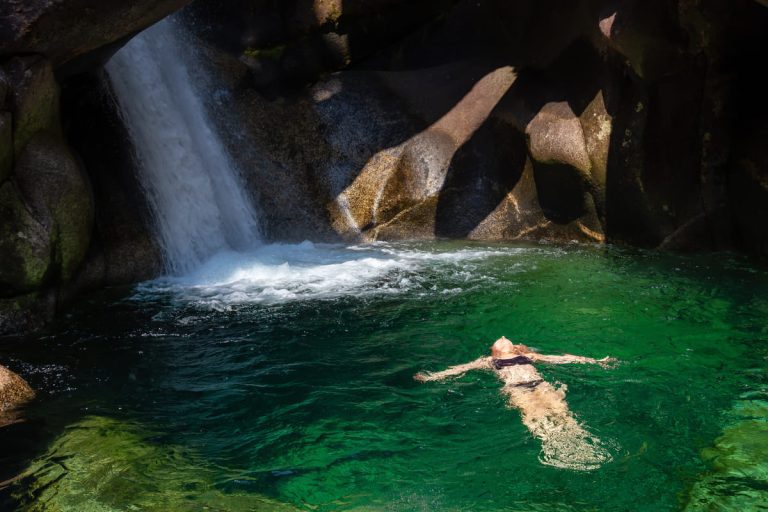 woman-enjoying-a-swim-in-the-glacier-river-running-2023-11-27-05-22-36-utc